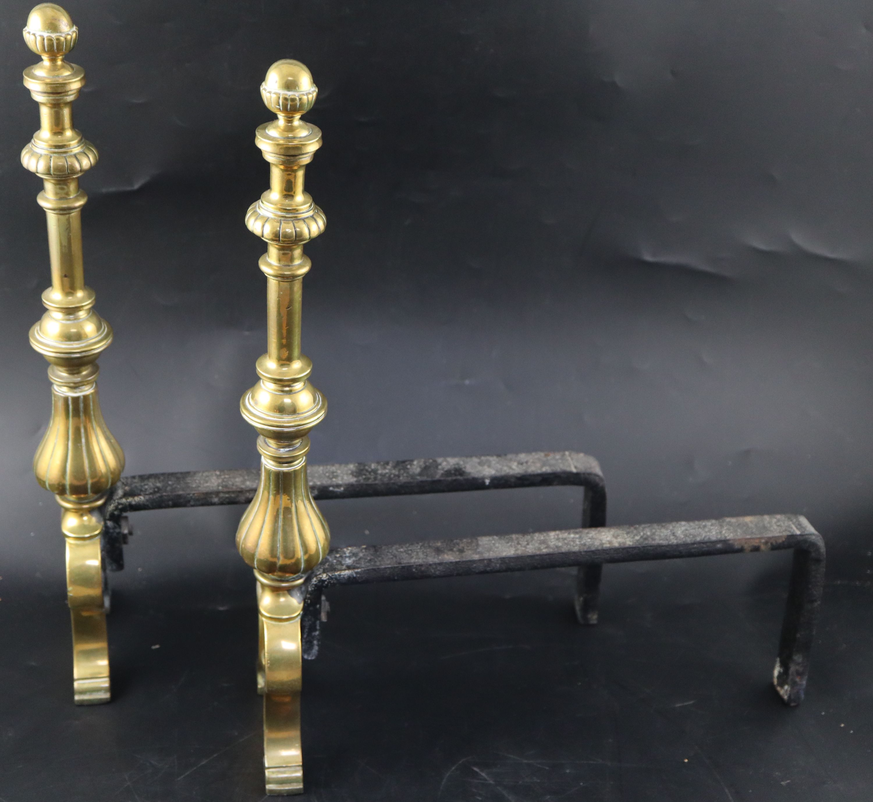 A George III brass and steel fender and pair of fire dogs